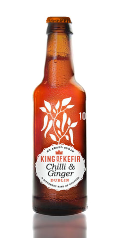 A bottle of King of Kefir Chilli & Ginger, a  ginger drink with a kick, a gentle fizz and 10 kcal per bottle. Fresh ginger root and birds eye chillis add some lingering heat